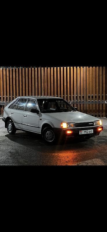 Mazda 323: 1987 г., 1.5 л, Механика, Бензин, Хэтчбэк — 1