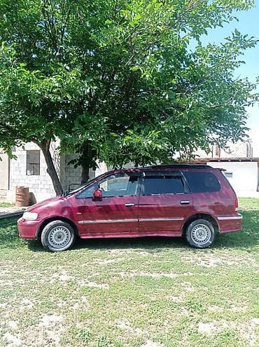 семиместное авто: Микроавтобус/универсал бордового цвета. Основные характеристики по — 2