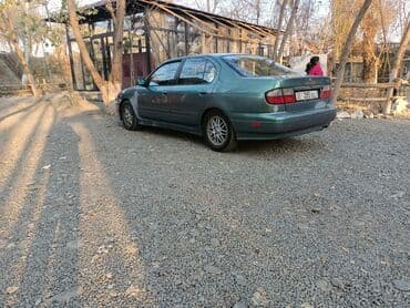 значок на авто: Nissan Primera: 2000 г., 2 л, Автомат, Бензиновая, Седан — 5