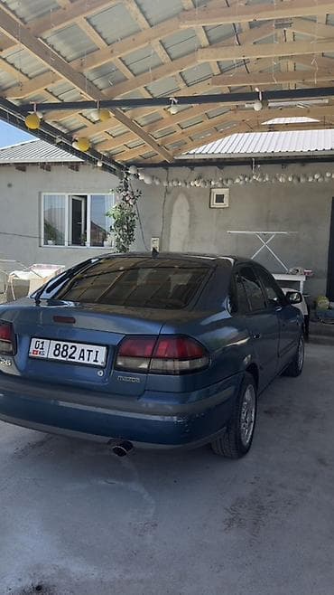 Mazda: Mazda 626: 1997 г., 1.8 л, Механика, Газ, Седан — 4