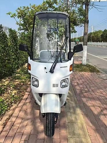 мапет хонда: Honda Canopy — трёхколёсный скутер с крышей и большим лобовым стеклом — 1