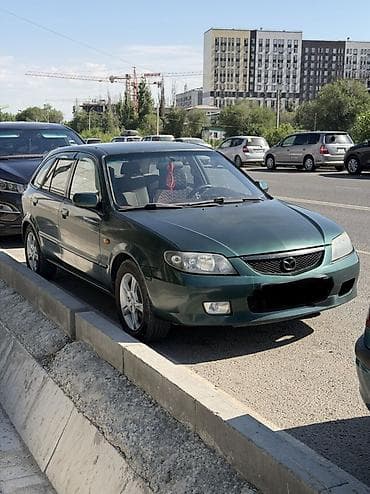Транспорт: Mazda 323: 2002 г., 1.6 л, Механика, Бензин, Хэтчбэк — 1