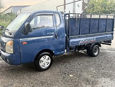 byd e2 2022: Hyundai Porter II, бортовой грузовик с открытой металлической — 3
