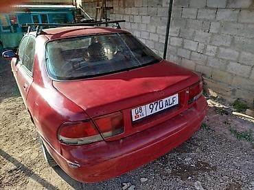 кирг шёлк: Mazda 323: 1995 г., Седан — 4