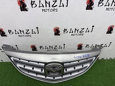 ate: Решетка радиатора Mazda 2002 г., Б/у, Оригинал — 2