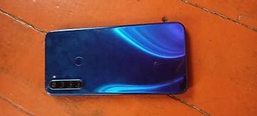 Мобильные телефоны: Смартфон с четырехмодульной основной камерой и сканером отпечатка — 1