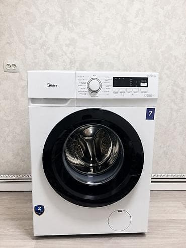 3 3: Стиральная машина Midea MFN70-S1403 с фронтальной загрузкой. Модель — 1