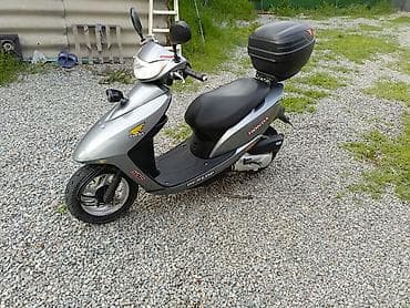 dio 27 af27: Скутер Honda (серия Dio) в серебристом цвете. Характеристики и — 5