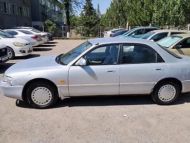 колпачки: Mazda Cronos: 1992 г., 2 л, Механика, Бензин, Седан — 5