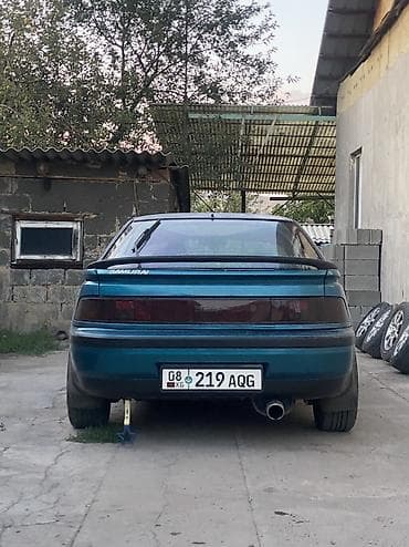 2107 газ: Mazda 323: 1992 г., 1.6 л, Механика, Бензин, Хетчбек — 4