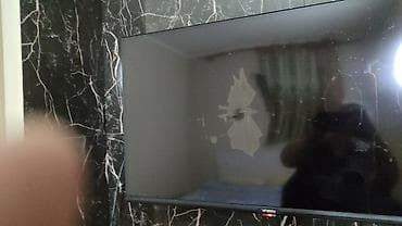 a 23: LED-телевизор V-SIN (диагональ ориентировочно 32–40") Описание: - — 2