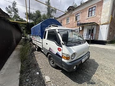ручной машина: Hyundai Porter — компактный бортовой грузовик с тентованным кузовом — 2