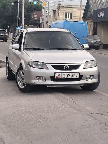 Mazda 323: 2003 г., 2 л, Механика, Газ, Хэтчбэк