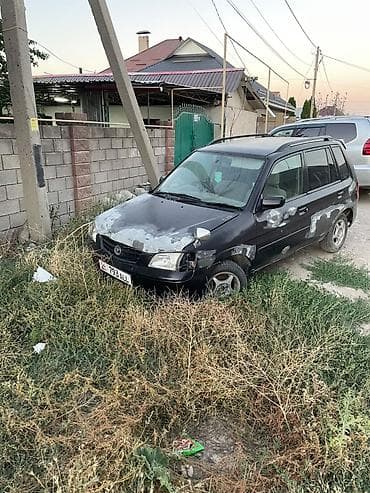 Mazda Demio: 2000 г. — 3
