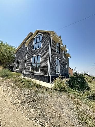Продаётся двухэтажный дом с мансардными фронтонами и большими