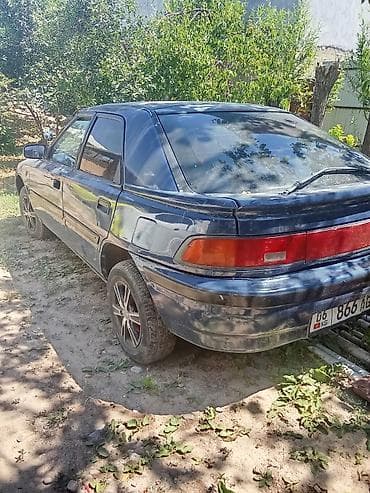 audio cd: Mazda 323: 1990 г., 1.4 л, Механика, Бензин, Хэтчбэк — 1