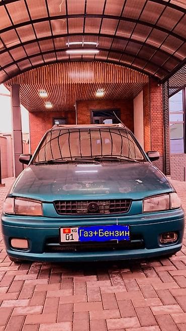 Mazda Demio: 1999 г., 1.3 л, Механика, Газ, Хэтчбэк