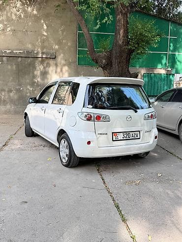 айни 95: Mazda Demio: 2005 г., 1.5 л, Автомат, Бензин — 6