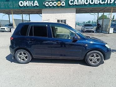 боковой: Mazda Demio: 2004 г., 1.5 л, Автомат, Бензин, Хэтчбэк — 3
