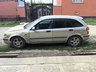 byd e2: Mazda 323: 1999 г., Механика, Бензин, Хэтчбэк — 9