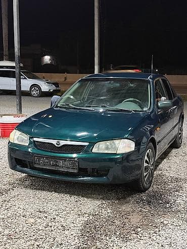 е34 люк: Mazda 323: 2000 г., 1.3 л, Механика, Бензин, Седан — 9