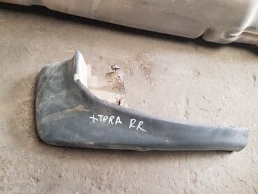 брызговики газ 53: Nissan X Terra брызговик, Ниссан Икстерра Задний правый брызговик — 1