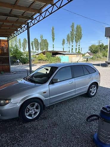yamaha n max: Mazda 323: 2003 г., 1.6 л, Механика, Бензин, Хэтчбэк — 3