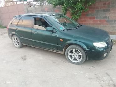 e 303: Mazda Familia: 2003 г., Универсал — 4