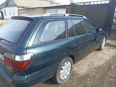 заглушка диска: Mazda Capella: 1998 г., 1.8 л, Механика, Бензин, Универсал — 6