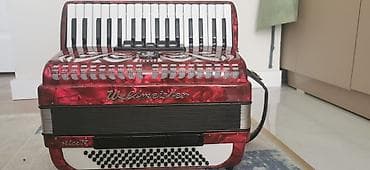 баян рубин: Аккордеон WELTMEISTER CAPRICE N с красным перламутровым корпусом — 1