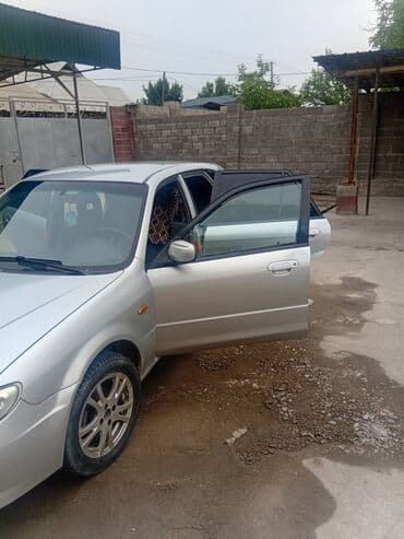автомобиль бу: Mazda 323: 2003 г., 1.3 л, Механика, Бензин, Хетчбек — 15