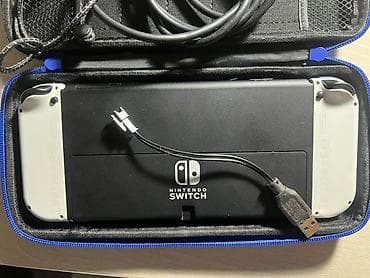nintendo switch сколько стоит: Игровая консоль Nintendo Switch OLED (белые Joy‑Con) - Экран 7" OLED — 5