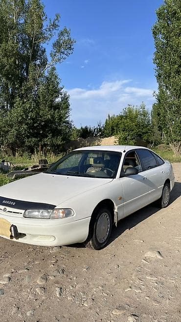 Унаа: Mazda 626: 1995 г., 1.8 л, Кол менен иштөөчү, Бензин, Хетчбек — 7