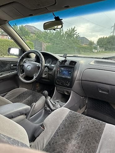 мазду: Mazda 323: 2000 г., 1.3 л, Механика, Бензин, Седан — 4