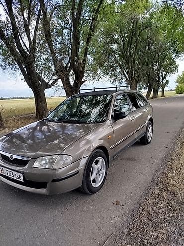 step wgn: Mazda 323: 1999 г., 1.6 л, Механика, Бензин, Универсал — 2