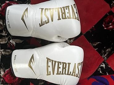 перчатки ufc: Боксерские перчатки Everlast Elite, белые с золотым логотипом. - — 1