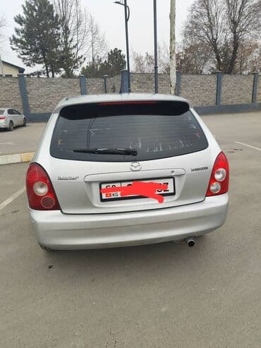 Ламинат: Mazda 323: 2002 г., 1.5 л, Автомат, Бензин, Универсал — 1