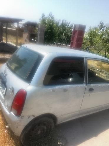 тетиктер: Daihatsu Cuore: 2002 г., 0.1 - engine capacity л, Кол менен иштөөчү, Бензин, Хетчбек — 4