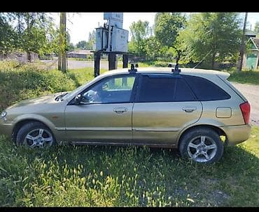 g wagon: Mazda 323: 2003 г., Универсал — 2