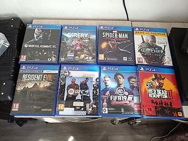 Игровая приставка Sony PlayStation 4 Slim с комплектом игр на дисках at lalafo.kg Игровая приставка Sony PlayStation 4 Slim с комплектом игр на дисках