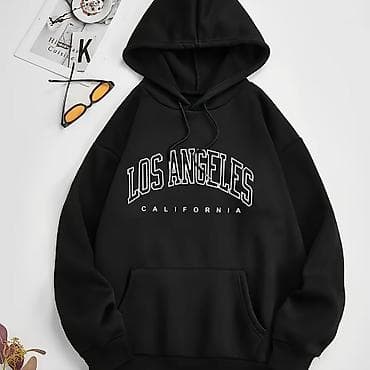 Стильная чёрная худи оверсайз с капюшоном и классическим кроем at lalafo.kg Стильная чёрная худи оверсайз с капюшоном и классическим кроем