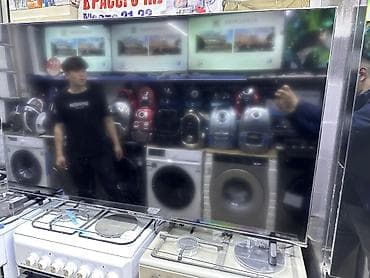 Телевизор с большим плоским экраном, тонкими рамками и глянцевой at lalafo.kg Телевизор с большим плоским экраном, тонкими рамками и глянцевой