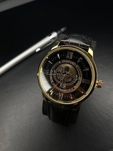 Элегантные наручные часы с золотистым корпусом и черным циферблатом at lalafo.kg Элегантные наручные часы с золотистым корпусом и черным циферблатом