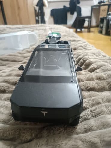 Игрушечная модель пикапа в стиле Tesla Cybertruck с прицепом/пушкой в at lalafo.kg Игрушечная модель пикапа в стиле Tesla Cybertruck с прицепом/пушкой в