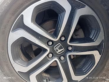 Диск колесный легкосплавный Honda с фирменным центральным колпачком H at lalafo.kg Диск колесный легкосплавный Honda с фирменным центральным колпачком H