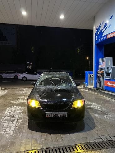 Седан черного цвета, компактный и экономичный. Кузов 4-дверный at lalafo.kg Седан черного цвета, компактный и экономичный. Кузов 4-дверный