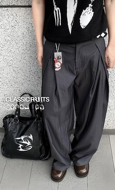 Широкие брюки с драпировкой и глубокими складками - Цвет: тёмно‑серый at lalafo.kg Широкие брюки с драпировкой и глубокими складками - Цвет: тёмно‑серый