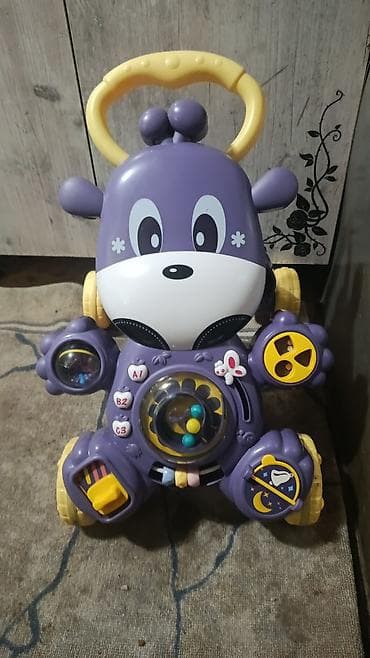 Развивающая каталка-ходунки для малышей в виде фиолетового зверюшки at lalafo.kg Развивающая каталка-ходунки для малышей в виде фиолетового зверюшки