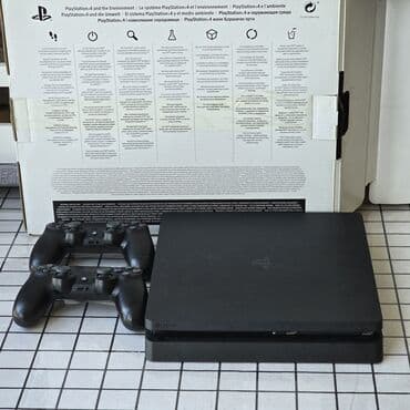 PS4 Slim 500Gb Прошитая 9.60 Комплектация: - консоль PS4 Slim - два at lalafo.kg PS4 Slim 500Gb Прошитая 9.60 Комплектация: - консоль PS4 Slim - два