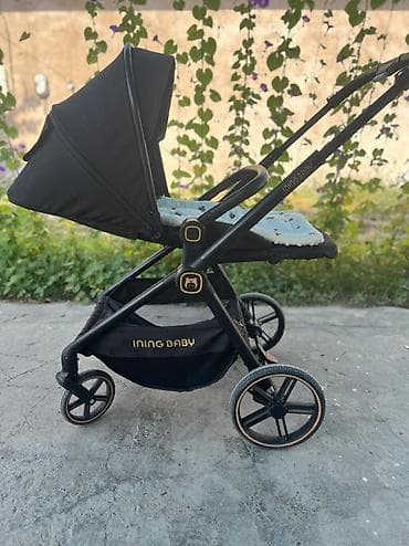 Универсальная детская коляска Ining Baby черного цвета с регулируемым at lalafo.kg Универсальная детская коляска Ining Baby черного цвета с регулируемым